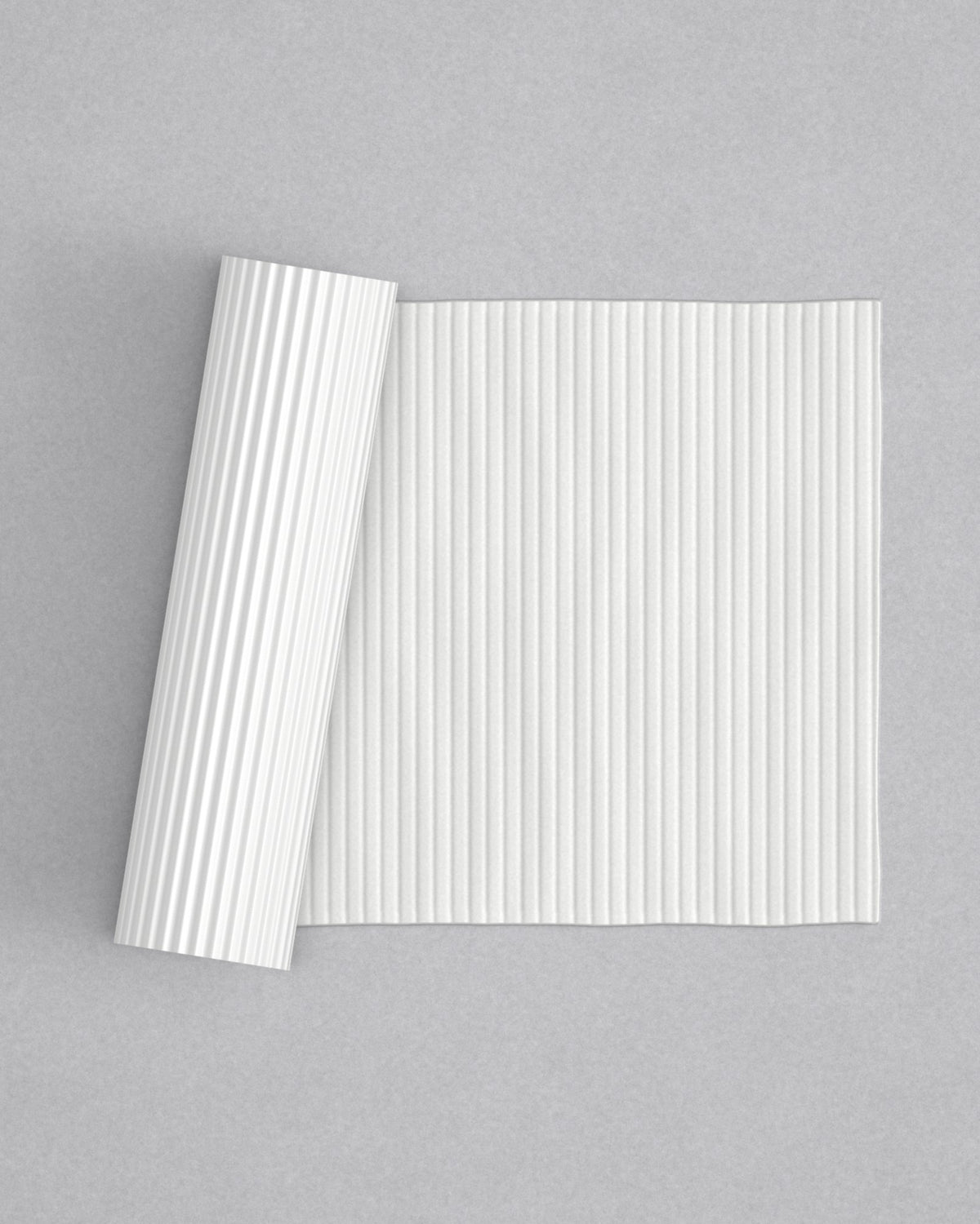 No.11 Reeded mini 4" texture rolling pin with its pattern rolled out on white fondant - Prop Options