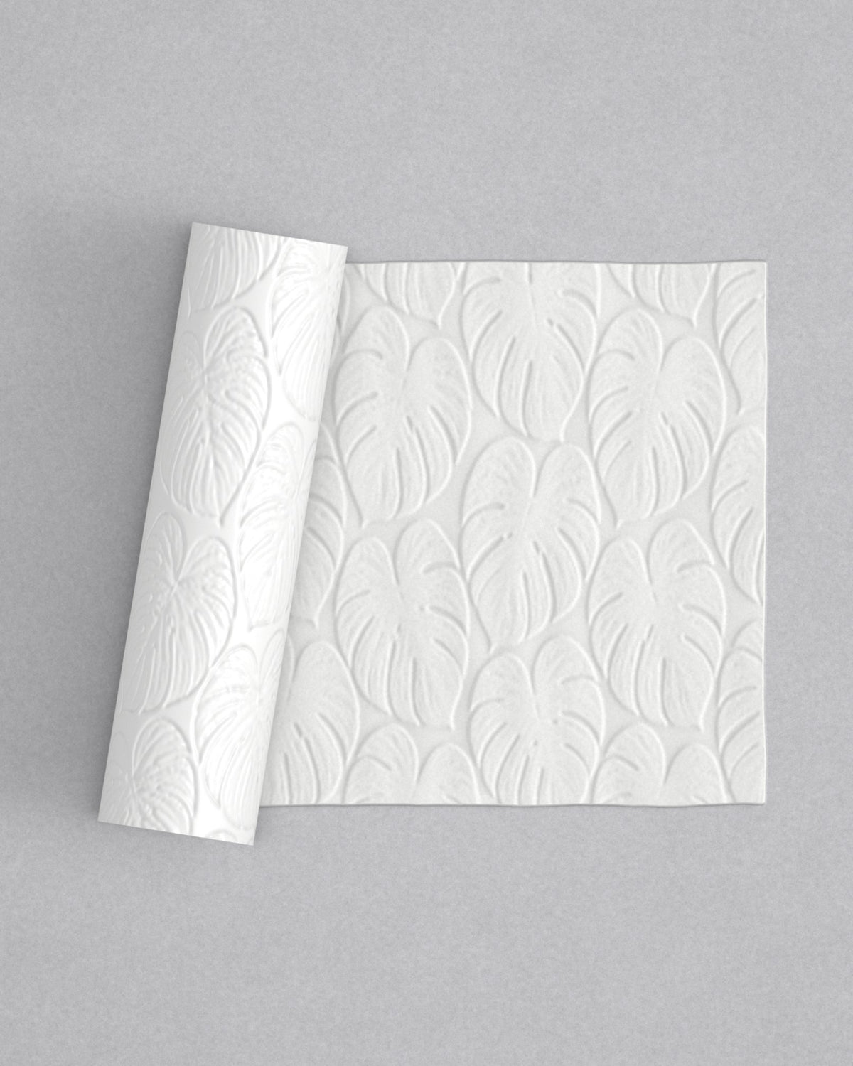 No.26 Monstera mini 4" texture rolling pin with its pattern rolled out on white fondant - Prop Options