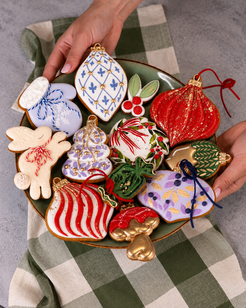 Platter of decorated Christmas cookies held in hand, Prop Options x Ekat's Christmas cookie set
