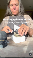 Pressing a clay circle into the clay sphere split mould