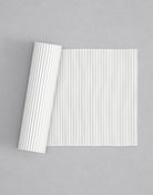 No.11 Reeded mini 4" texture rolling pin with its pattern rolled out on white fondant - Prop Options