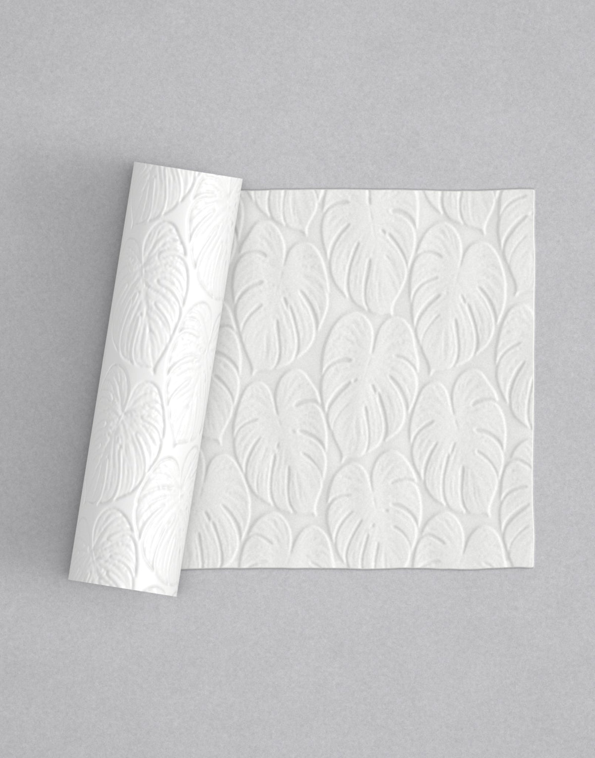 No.26 Monstera mini 4" texture rolling pin with its pattern rolled out on white fondant - Prop Options