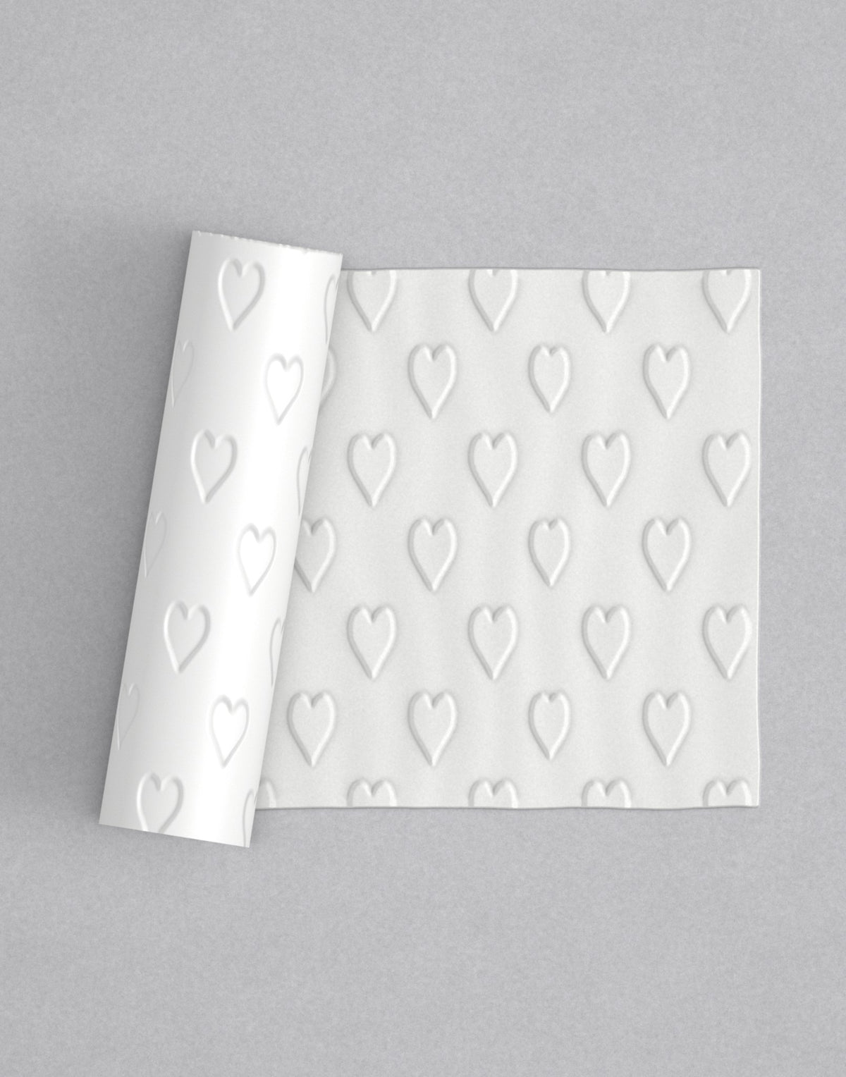 No.73 Hearts mini 4" texture rolling pin with its pattern rolled out on white fondant - Prop Options