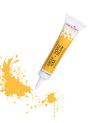 Tube of yellow food color with splashes on a white background