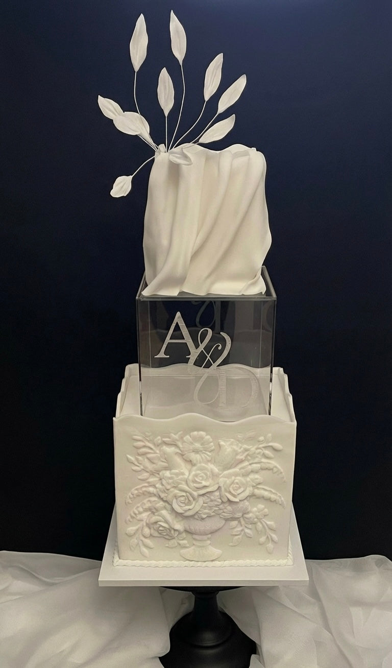 Personalised clear acrylic cake spacer between soft sculpted textured wedding cake tiers