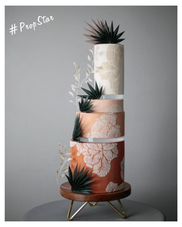 Prop Options #PropStar - Shop the look - gold hairpin acacia wood stand supporting stunning 4 tier cake with exquisite decoration and using Prop Options' ultra-clear acrylic disc spacers