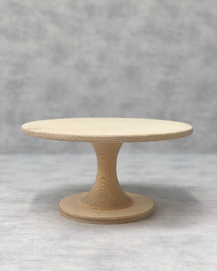 The Hourglass Scandinavian Birch Cake Stand standard size in a natural finish - Prop Options