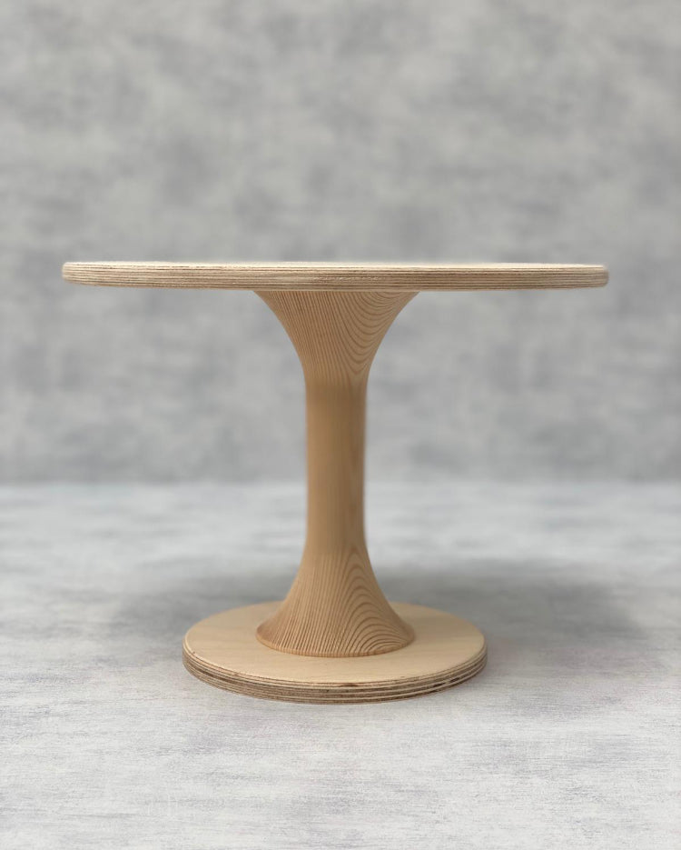 The Hourglass Scandinavian Birch Cake Stand tall size in a natural finish - Prop Options